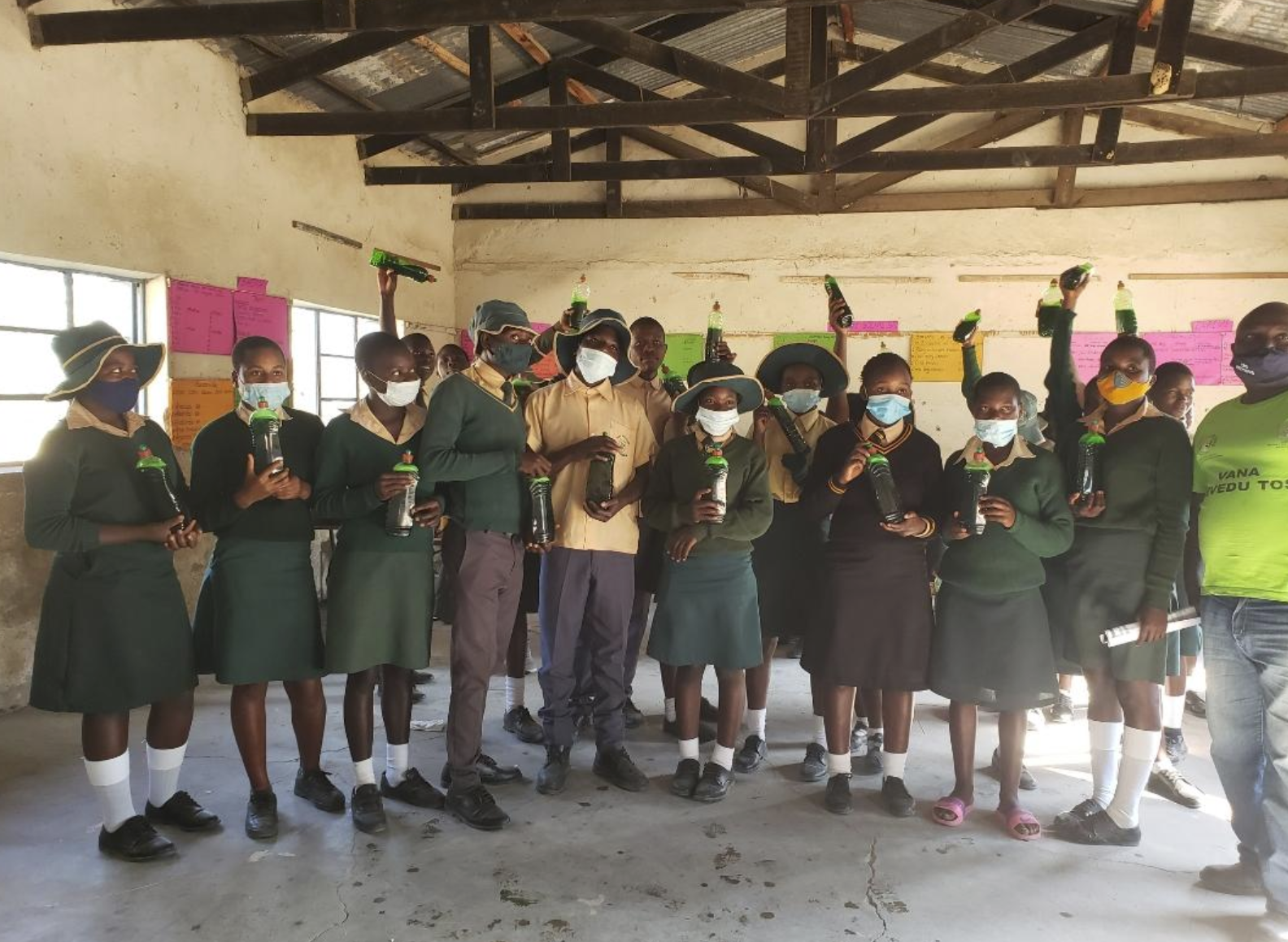 Staff distributing hygiene materials and conducting health outreach in the field