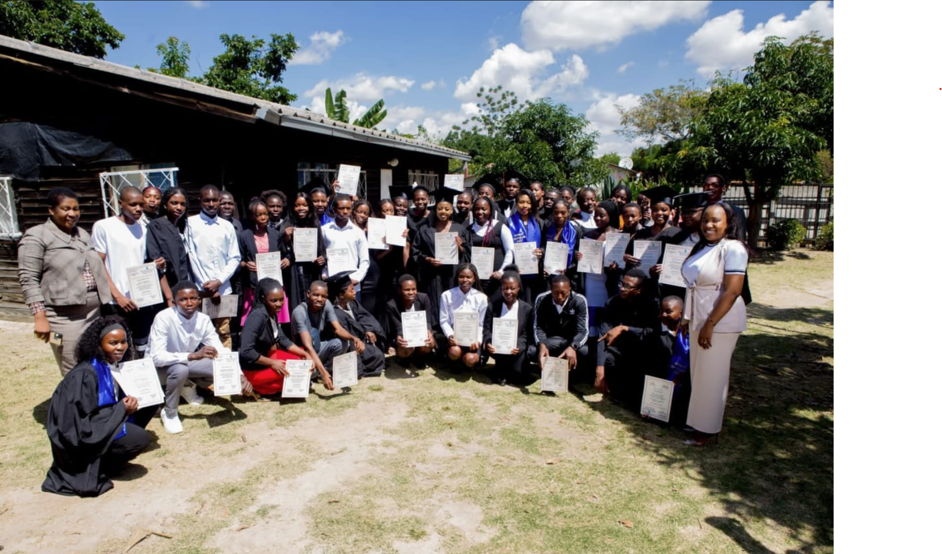 Group of active Zimbabwean youth celebrating skills development and empowerment