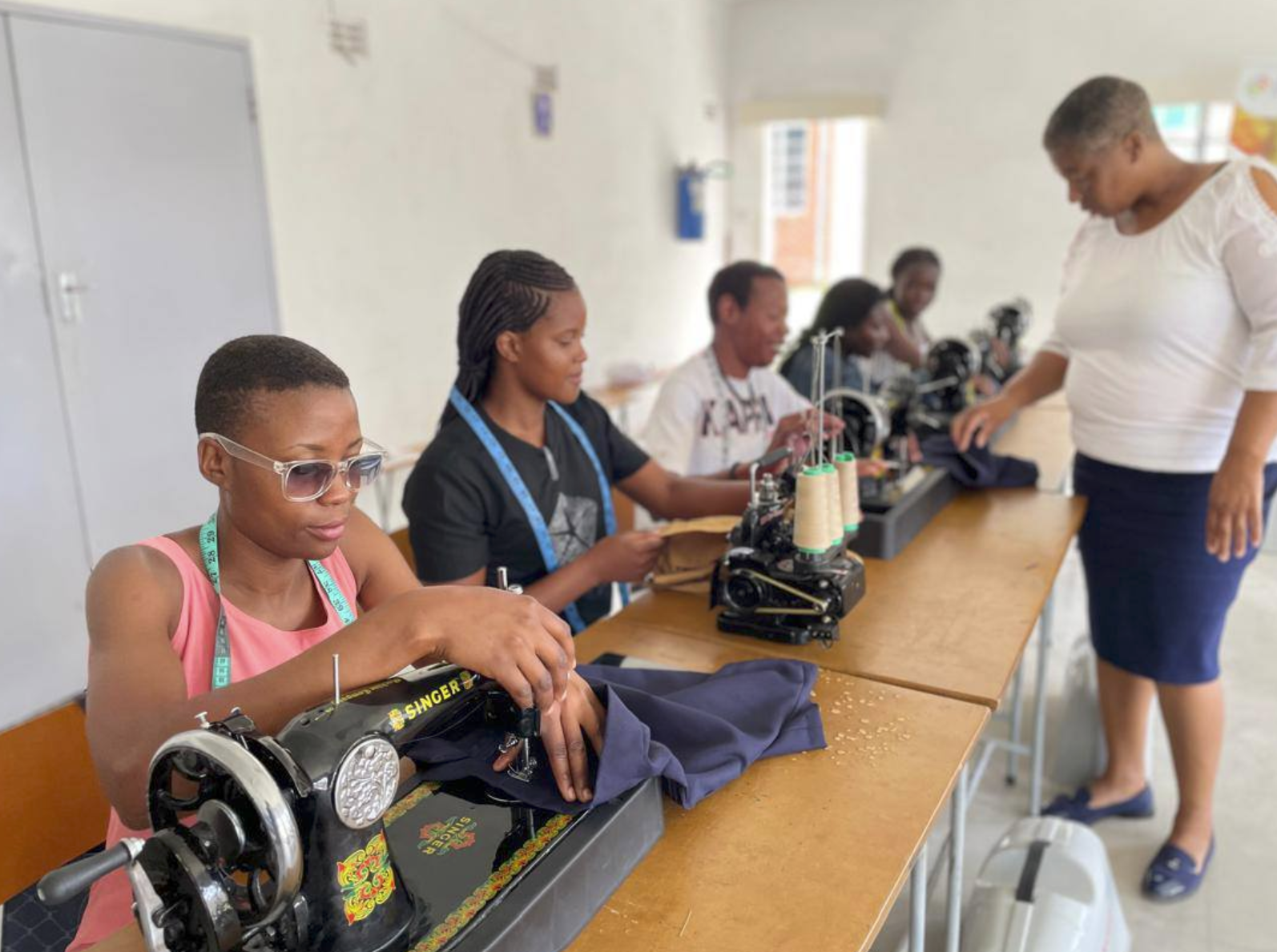 Young Zimbabwean woman learning sewing and tailoring skills
